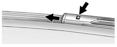 2. Press the button in the middle of the wiper arm connector and pull the wiper