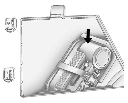 1. Press down on the latch tab and pull the cover off to access the storage compartment.