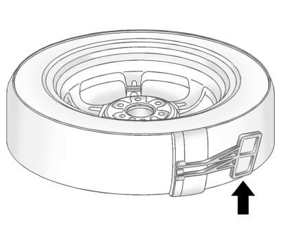 9. Remove the plastic spare tire heat shield by pulling the rubber latch. Store